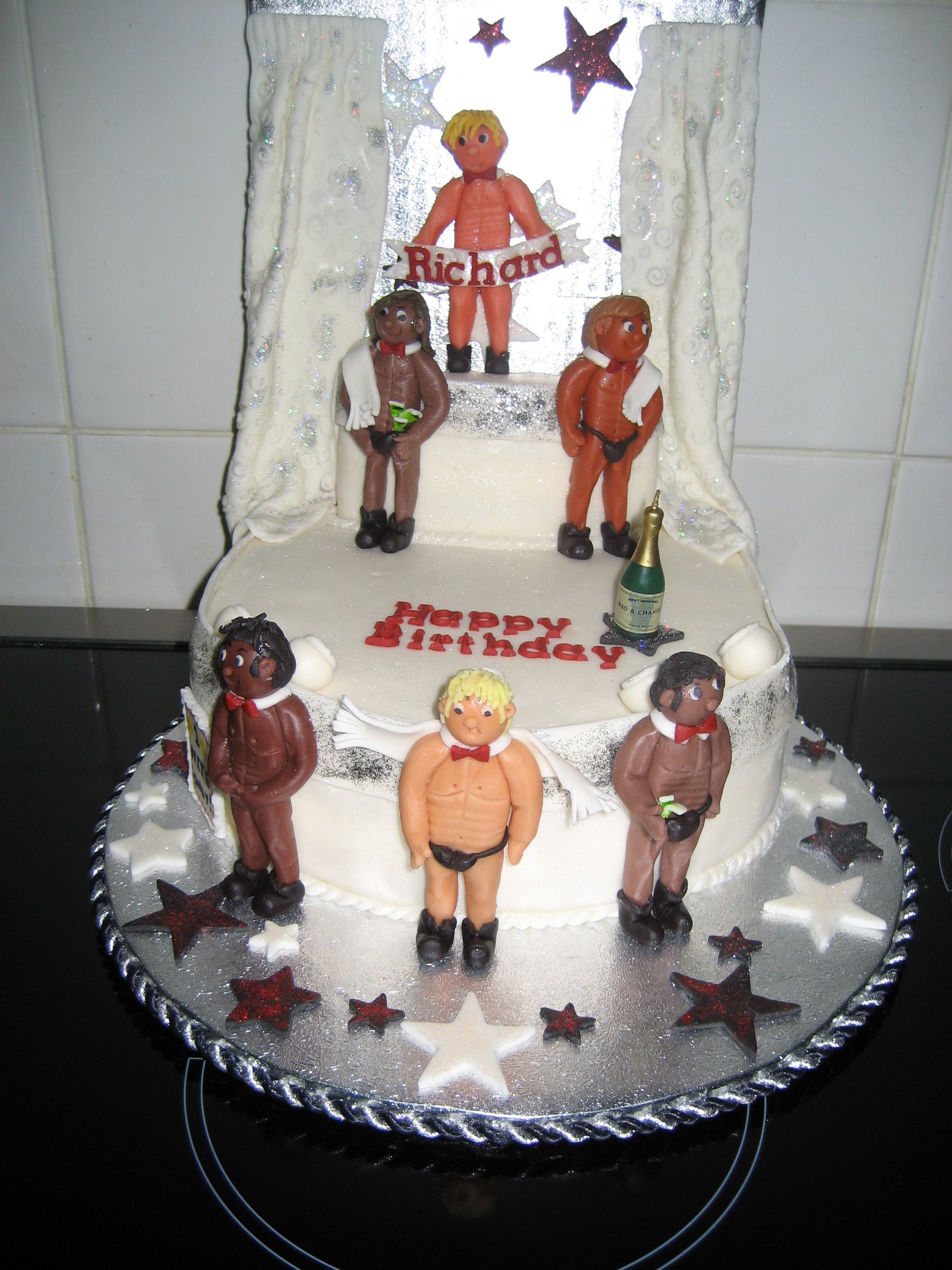 Male Strippers White cake, raspberry filling. Debbie brown inspired, and yes that is a male name on there, the recipient is gay.