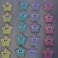 Dora Star Cookies Cookies I made to go with the Dora Cake. Eyes are colour flow, details using icing writers.