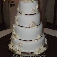 Seashell Wedding The cakes were chocolate, vanilla, and strawberry. It's covered in pettenice and white chocolate seashells.