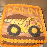 Dump Truck chocolate cake with chocolate buttercream and crushed oreos. Copied picture from a kids book.
