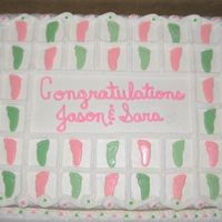 Pitter Patter This is a half and half cake with BC icing. They feet are chocolates that I made with a mold.