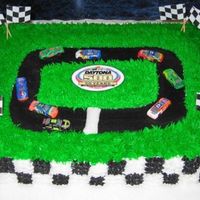 Daytona 500-Gentlemen, Start Your Engines! I made this for a Daytona 500 party. My hubby helped me with the flags, the logo in the middle, and the cars. He is a huge racer! Have to...