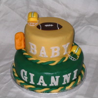 Football Baby Shower My first tiered cake. Made cake for my friends baby shower a Football theme, her husband is a Green Packer fan.