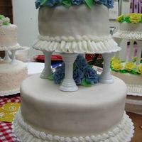 Wilton Course Iii Wedding Cakes My flowers were suppose to be purple but the fondant turned blue. Made about 50 fondant roses for this class. I love this cake.