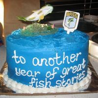 Fish Cake Went to walmart and paid $5 for the fish topper. Used the oval pans I got during Wilton Course II. Super easy!