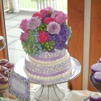 Purple Wedding Cake With Cupcakes 