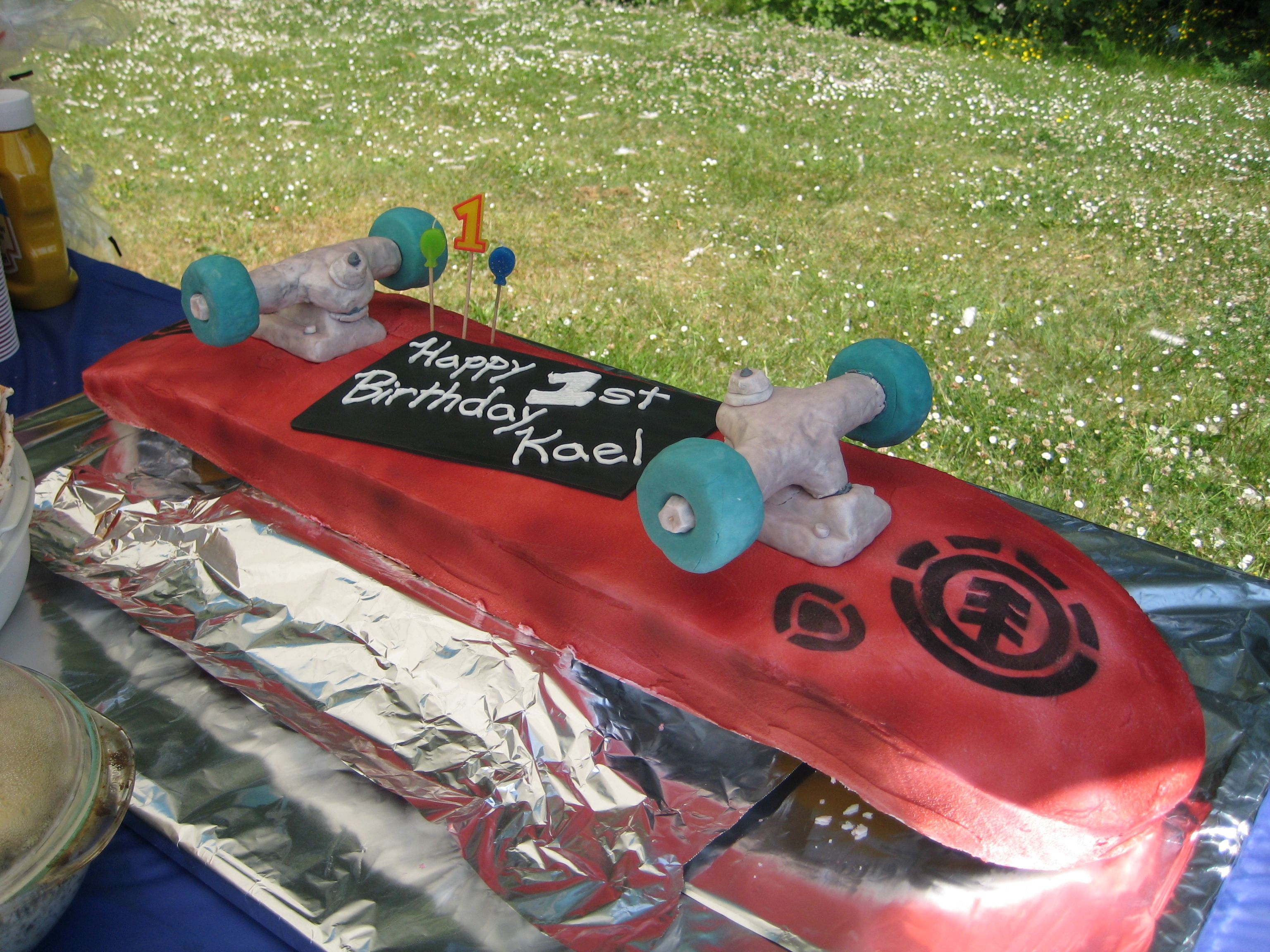 Skateboard Cake - Actual Size This cake was huge! Wheels and trucks made out of rice krispies covered with fondant.