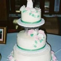 My First Wedding Cake My first official wedding cake. The tiers were yellow and hummingbird cake covered in buttercream icing. The carnations and leaves were...