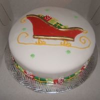 Sleigh Full Of Presents A fondant covered cake with royal icing and fondant presents