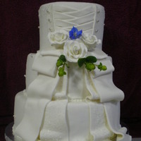 Wedding Cake this is my first wedding cake. first tier is a diabetic cake and icing(made with splenda). second tier is vanilla with raspberry preserve...