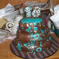 Teal And Brown Circle Cake 10" and 6" are white butter cake w/ raspberry mouse filling. 8" is choc. butter cake w/ raspberry mouse filling. All is...