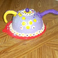 Ist Attempt Teapot My 1st attempt teapot cake for my mom. Cake mix baked in a bowl with fondant hardware. I was much happier with my 2nd attempt.