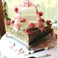 Square Fondant Cake Fondant cake with pink fondant bow and ribbons.