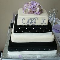 Black And White Wedding Cake Cake for about 175 people in buttercream with fondant "ribbons".