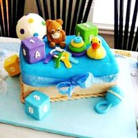Baby Toys Chocolate cake with roasted almond cover MMF. evrything edible accept support.