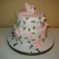 Parents 40Th Anniversary white cake with strawberry filling. buttercream icing and decorations. butterflies are royal icing