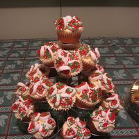 Christmas Cupcakes white cake with apricot/Grand Marnier filling. Buttercream frosting. Marshmallow flowers.