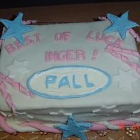 Farewell Cake Vanilla cake with vanilla custard. Covered in Fondant with fondant decorations. Sign and stars in ColorFlow icing.