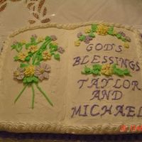 Christening Book Cake This was a celebration for a boy and girl, so the customer decided on yellow and violet flowers (royal icing). Violet border and writing....
