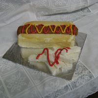 Hot Dog And Fries Cake This was a request for a friend. The hot dog roll is carved out of angel food cake and the "hot dog" is two Little Debbie "...
