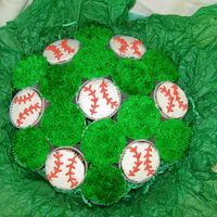 Baseball Theme Cupcake Bouquet Made this last year for my husband's birthday. He's a baseball guy and I really wanted to try a cupcake bouquet a different want...