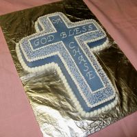 Baby's Baptism Cross Cake Made this for a baby boy's baptism. Used the Wilton cross shaped pan. All BC. Did Cornelli Lace design and bead borders.