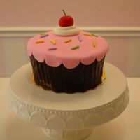 Cupcake Cake Fondant covered vanilla rum cake with fondant cherry and sprinkles. Thanks for looking!