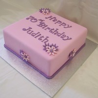 Pink Birthday Square 10 inch caramel mud cake covered in pink fondx
