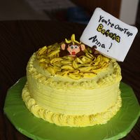 Top Banana I made this for a neighbor of ours after she saw my son's top banana cake. Buttercream... the monkey and bananas are made from fondant...