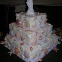 Seashell Wedding Cake Chocolate sea shells with luster dust. 2 layers "dummy cake", bottom real cake.
