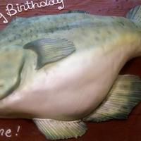 Big Bass Cake Birthday cake depicting a big bass. Used luster dust to obtain the color.