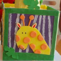 Giraffe Side Of Wyatt's 1St Birthday Cake Block cake - 4 8" square cakes stacked, iced in buttercream with fondant panels. Top cake is 2 4" cakes stacked, iced in...