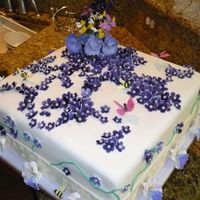 Normal_Td2.jpg 14" fondant covered strawberry with strawberry whipped buttercream. All Flowers are gumpaste and airbrushed. Fondant broder was a...