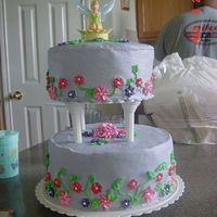 Tinker Bell My first try at a tier cake. Made it for niece bc icing with royal icing flowers