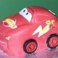 Mcqueen Side View fondant over carved cake, painted details.