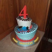 Whimsical Thomas Cake Little boy LOVES Thomas, last year I did a 3D cake of Thomas for him and this year had ot come up with different Thomas idea, so this is...