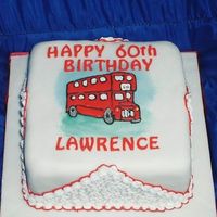 60Th Birthday Fruit cake covered in marzipan and fondant. The bus is a royal icing run out and there is filigree work on the sides