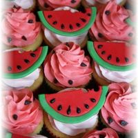 Watermelon Cupcakes cupcakes in green and red liners with fondant watermelon toppers I made. The seeds are black royal icing. Thanks for looking!