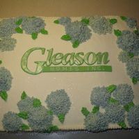 Hydrangea Cake This was a sheet cake for an open house. The name was cut out of fondant, and the hydrangeas are made out of butter cream