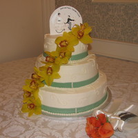 Simple Wedding Cake This is a white cake with a strawberry and custard filling covered in buttercream. The flowers are real, the ribbon is fondant, and the...
