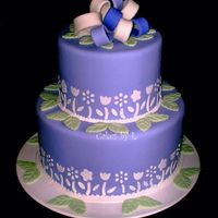 Spring Theme Cake MMF covered cake with MMF decorations. The cake is actually purple with light and dark purple and white loops but the camera made it look...
