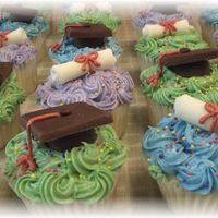 Grad Caps And Diploma Cupcakes Buttercream with fondant accents.