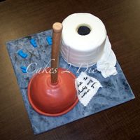 Happy Birthday Plunger is a Chocolate cake filled with chocolate kahlua buttercream icing. Handle is made from fondant. Toilet paper is a vanilla cake...