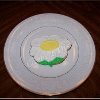 Daisy Cookies Daisy Sugar Cookie decorated with Alice cookie icing. Overpiped to give a 3-D effect.