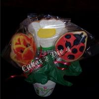 Daisy Cookie Bouquet Sugar Cookies decorated with Alice Cookie icing. Lady bug, Daisy and Hand-Painted Tulip. The pot inspired these cookies. It's painted...