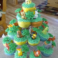 My Little Boy's 1St Birthday...jungle Theme Cupcakes covered with colored melted candy, trees are done with royal icing ans pretzles. Then iced with buttercream icing and added a...