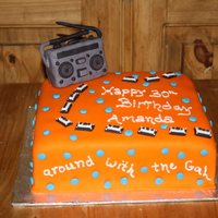 80's Theme this was an 80's theme birthday cake. Cake covered in fondant, boombox is made out of rice crispies treat and then covered in fondant...