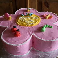 Flower With Little Bugs Cake covered with buttercream and bugs are MMF, had fun making them. This eas for a little girl 1st birthday