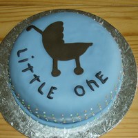 Baby Shower Cake Caked covered with fondant, traced out the cariage out of fomdant. I am not good to write so tried to do the letters as a kid style