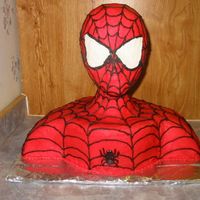 Spiderman This cake is white cake with buttercream frosting. The head is a wig head.
